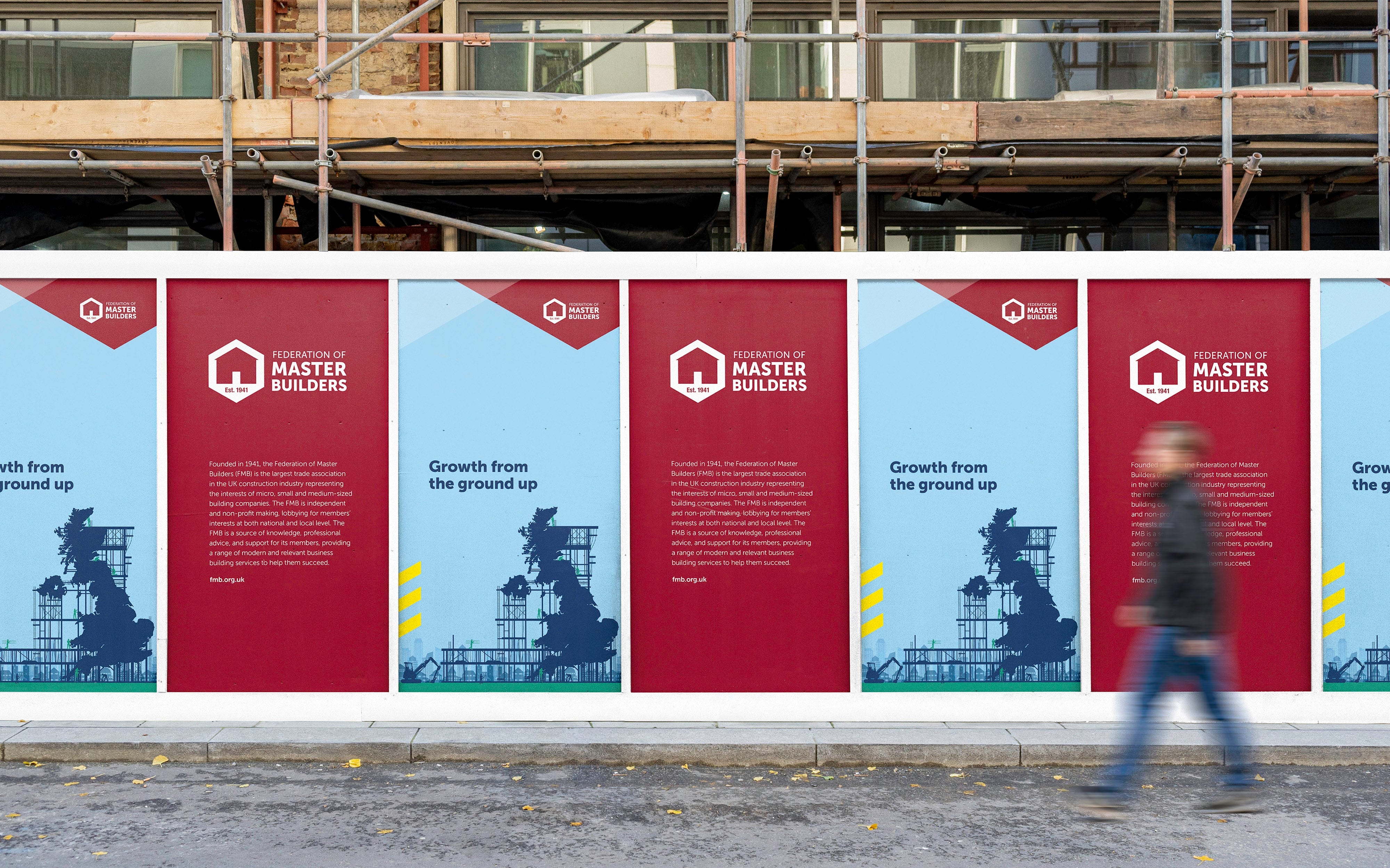 Federation of Master Builders logo and wordmark in new identity shown on construction site hoarding